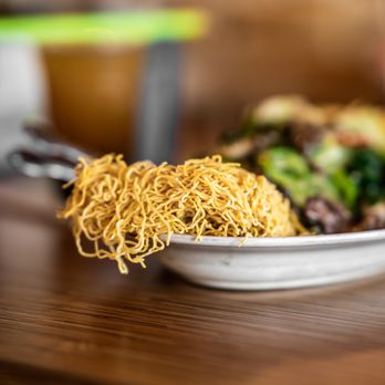 Noodle World - Quality crispy noodles dangling off the side of the chow mein with beef and crispy noodle plate. - Chinese Near Me - Alhambra, California Noodle World - Quality crispy noodles dangling off the side of the chow mein with beef and crispy noodle plate. - Chinese Near Me - Alhambra, California