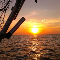 Thumbs Up Charter Services - It's not all about fishing. Evening charters often lead to spectacular sunsets on Saginaw Bay.