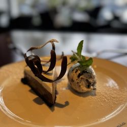 A PCH - Chocolate silk pie - A rich chocolate-silk style filling served on an Oreo cookie crust, topped with mascarpone and Oreo whipped cream