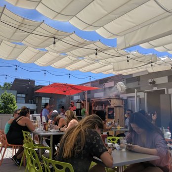 Four Friends Kitchen - Roof top area includes live music which wasn't over powering. - Southern Near Me - Denver, Colorado Four Friends Kitchen - Roof top area includes live music which wasn't over powering. - Southern Near Me - Denver, Colorado