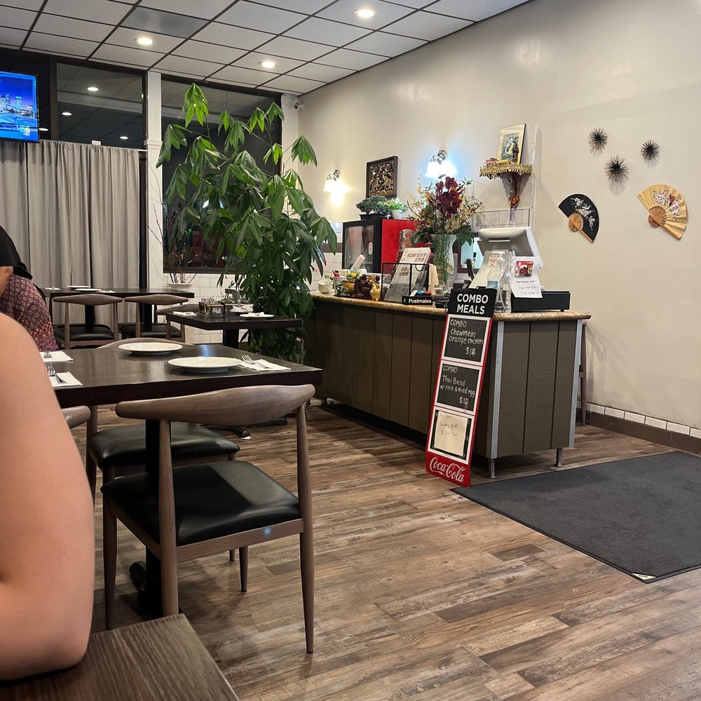 Lucky's Thai Pantry - a woman sitting at a table - Thai Near Me - Orange, California Lucky's Thai Pantry - a woman sitting at a table - Thai Near Me - Orange, California