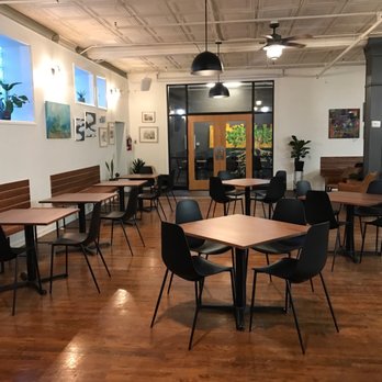 Porchlight Coffee - tables and chairs in a coffee shop - Coffee & Tea Near Me - Akron, Ohio