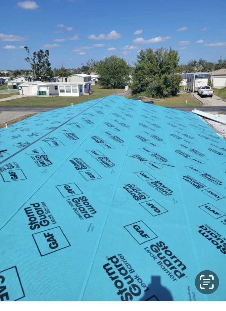 Slide of ARK Roofing