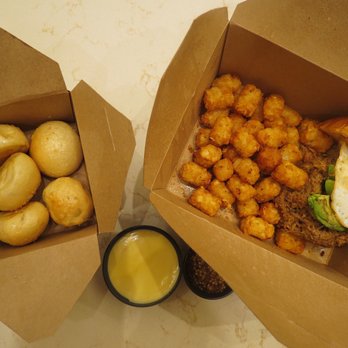 Lulu's Allston - Pretzel bites on the left, beer cheese dip and mustard dip in the middle, hot mess pulled pork sandwich with pizza tater tots on the right! - New American Near Me - Boston, Massachusetts