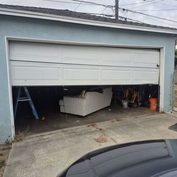 Precision Overhead Garage Door Service - Garage door stuck at an angle - Garage Door Services Near Me - Long Beach, California Precision Overhead Garage Door Service - Garage door stuck at an angle - Garage Door Services Near Me - Long Beach, California