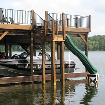M & R Construction - a boat dock with a slide - General Contractors Near Me