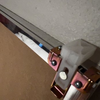 Essential Home Services - It's hard to see but these white plastic pieces on the top were damaged due to the botched install - Handyman Near Me - North Las Vegas, Nevada