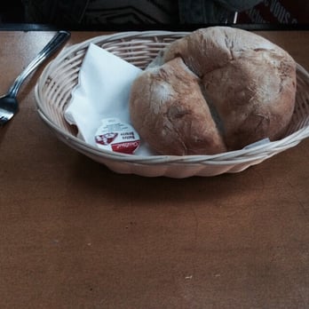 Da Silva - a loaf of bread in a basket on a table - Portuguese Near Me - Montreal, Quebec Da Silva - a loaf of bread in a basket on a table - Portuguese Near Me - Montreal, Quebec