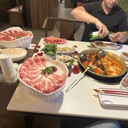 Fresh Scallops,wagu beef, beef,hand made wontons, beef balls, mushrooms,lamb and Tom yum soup and house special chili  broth