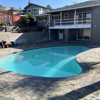 Intuitive Landscape & Construction - New pavers and pool coping with tile - Landscaping Near Me