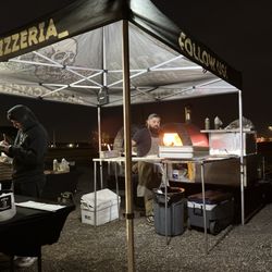 Otra Pizzeria - Pizza in the oven!