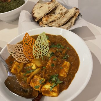 Persis Indian Grill - a bowl of curry and a plate of naan bread - Indian Near Me - Monroe Township, New Jersey Persis Indian Grill - a bowl of curry and a plate of naan bread - Indian Near Me - Monroe Township, New Jersey
