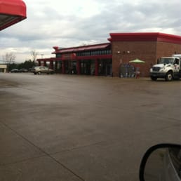 a view of a gas station from a car window a view of a gas station from a car window