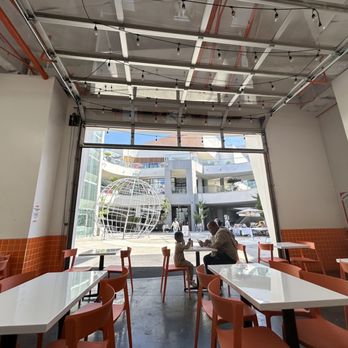 Overflo. - Open garage door in the seating area. - Desserts Near Me - Buena Park, California Overflo. - Open garage door in the seating area. - Desserts Near Me - Buena Park, California