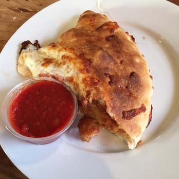 Alpha Pizzeria - Eggplant and chicken parmesan calzone. So good. This is half of one. - Italian Near Me - Port Richey, Florida Alpha Pizzeria - Eggplant and chicken parmesan calzone. So good. This is half of one. - Italian Near Me - Port Richey, Florida