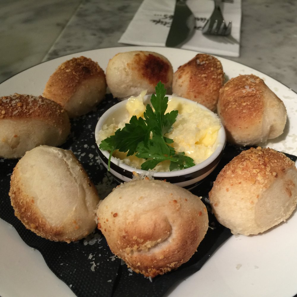 Pizza Express - Dough Balls Formaggi - tiny (see fork in background) tasteless bread balls w/ grated cheese sprinkled on top and some butter - Pizza Near Me - London, XGL Pizza Express - Dough Balls Formaggi - tiny (see fork in background) tasteless bread balls w/ grated cheese sprinkled on top and some butter - Pizza Near Me - London, XGL