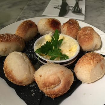 Pizza Express - Dough Balls Formaggi - tiny (see fork in background) tasteless bread balls w/ grated cheese sprinkled on top and some butter - Pizza Near Me - London, XGL Pizza Express - Dough Balls Formaggi - tiny (see fork in background) tasteless bread balls w/ grated cheese sprinkled on top and some butter - Pizza Near Me - London, XGL
