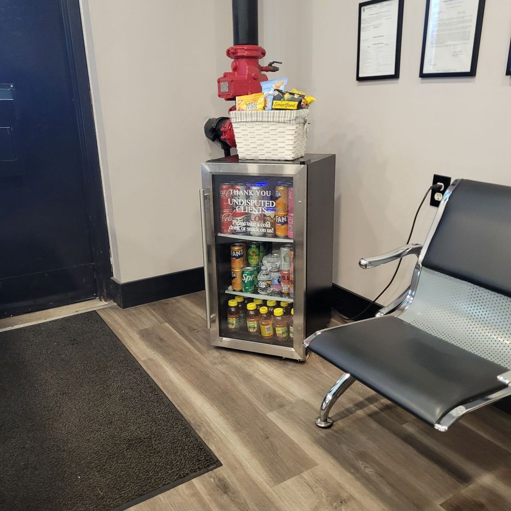 Undisputed Auto Care - Part of the waiting area with snacks and drinks. - Auto Repair Near Me - Sterling, Virginia Undisputed Auto Care - Part of the waiting area with snacks and drinks. - Auto Repair Near Me - Sterling, Virginia