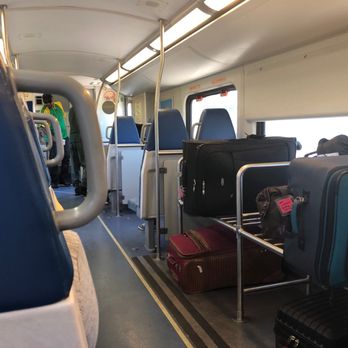 Tri-Rail - Tri-Rail car. Lots of luggage going to airport - Trains Near Me - Pompano Beach, Florida Tri-Rail - Tri-Rail car. Lots of luggage going to airport - Trains Near Me - Pompano Beach, Florida