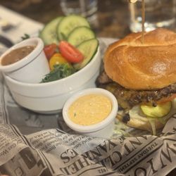 The Source Plates and Pours - Burger with house salad