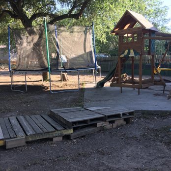 ProTech Landscaping - a playground with a swing set and a trampol - Landscaping Near Me ProTech Landscaping - a playground with a swing set and a trampol - Landscaping Near Me
