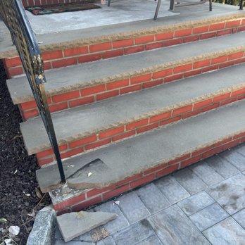 AA-1 Douglas Construction - This is one damaged slab. The other slab had cracks around the base where the railing is attached - Roofing Near Me