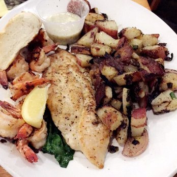 Cafe Americain - The catfish and shrimp plate with (burnt) potatoes. :/ - American Near Me - Baton Rouge, Louisiana