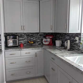 CB Construction - a kitchen with white cabinets and grey countertops - General Contractors Near Me - Simi Valley, California CB Construction - a kitchen with white cabinets and grey countertops - General Contractors Near Me - Simi Valley, California