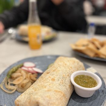 Sabroso - a plate of food with a burrito and a bowl of salsa - Mexican Near Me - Reno, Nevada Sabroso - a plate of food with a burrito and a bowl of salsa - Mexican Near Me - Reno, Nevada