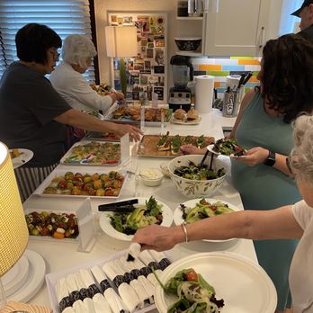 GMarket Chef - Everyone filling their plates. So many compliments on the food! - Caterers Near Me