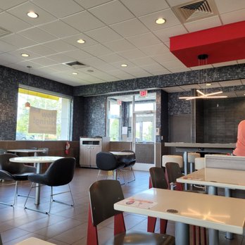 McDonald's - a man preparing food in a restaurant - Fast Food Near Me - Hartville, Ohio