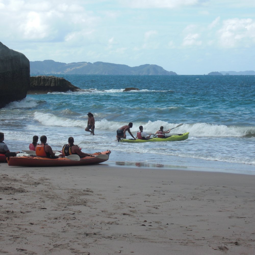 Cathedral Cove - Kayaks braving the choppy seas - Landmarks & Historical Buildings Near Me
