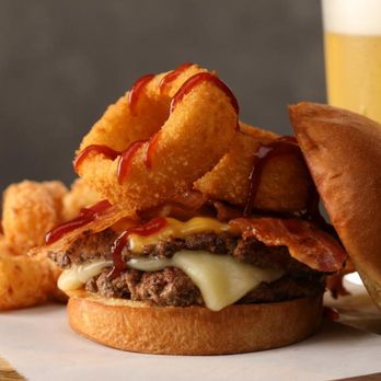 Hickory Tavern - a burger with onion rings and a beer - American Near Me - Hickory, North Carolina Hickory Tavern - a burger with onion rings and a beer - American Near Me - Hickory, North Carolina