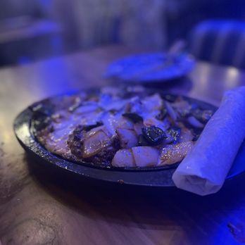 Condesa - Watertown - Vibey lighting makes it hard to photograph! This is the delicious Queso Fundido appetizer - Mexican Near Me - Watertown, Massachusetts