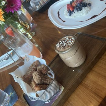 Aurora At The Celeste - Croissant Dough Beignet Bites with Cinnamon Sugar and Nutella Cream - American Near Me - Orlando, Florida