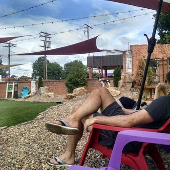 Bark Bar & Grille - Some nice seating. It gets pretty dang hot, but there's some shade and umbrellas to help - Hot Dogs Near Me - Little Rock, Arkansas