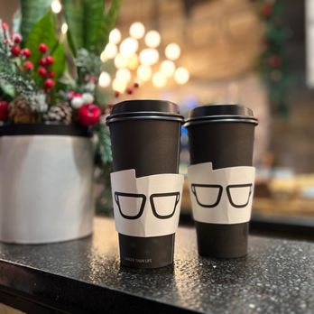 Gregorys Coffee - two coffee cups with glasses on them - Coffee & Tea Near Me - New York, New York