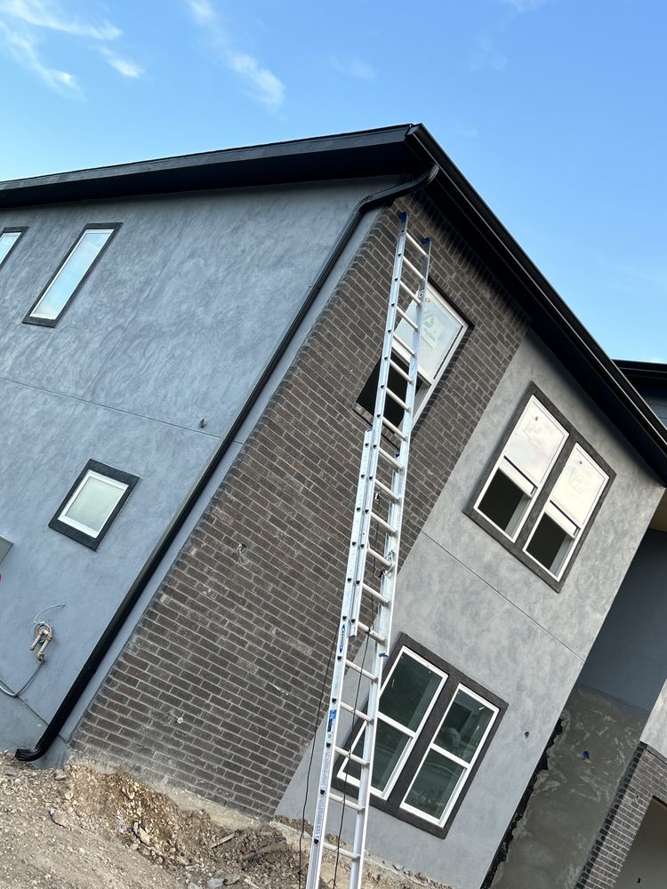 Slide of Gonzalez Seamless Rain Gutters