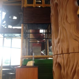 a wooden treehouse with a ladder a wooden treehouse with a ladder