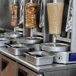 Efi's Gyro - Chicken , Pork & Lamb cut to order .