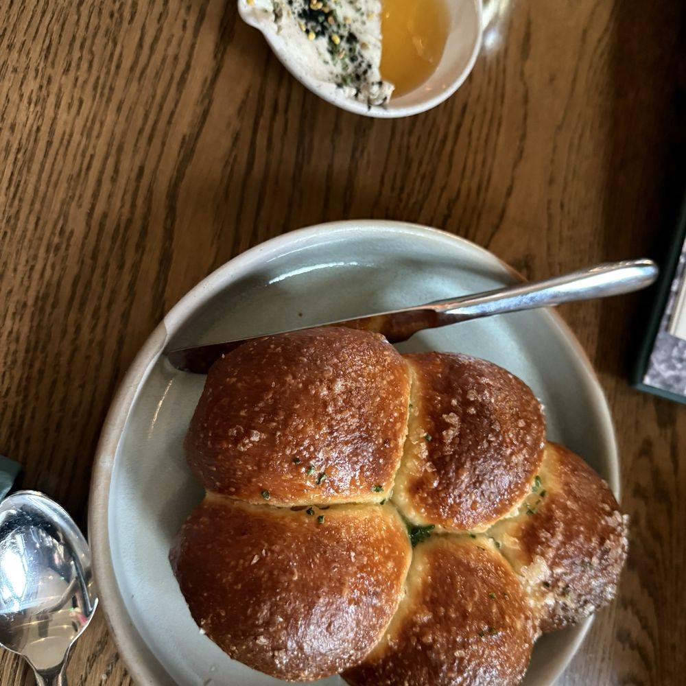 Rolls (served hot with salty top) with butter and honey Rolls (served hot with salty top) with butter and honey