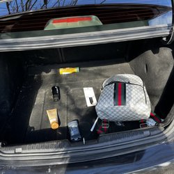 Nifty Car Rental - Someone's overnight bag and toiletries left in the trunk.