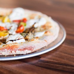 Spirit Restaurant & Bar - Burrata Pizza 
Fresh Burrata filling toped with burrata chunk , cherry tomato , thyme , Balsamic Glaze