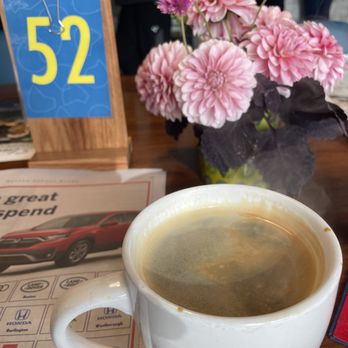 Flour Bakery + Cafe - Americano mug (large) and the newspapers. - Bakeries Near Me - Boston, Massachusetts