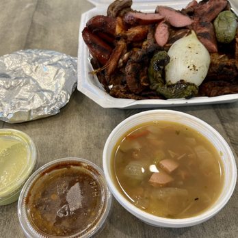 El Norteño: Pollos Asados Estilo Monterrey -  a table with a variety of food items - Food Trucks Near Me - Katy, Texas