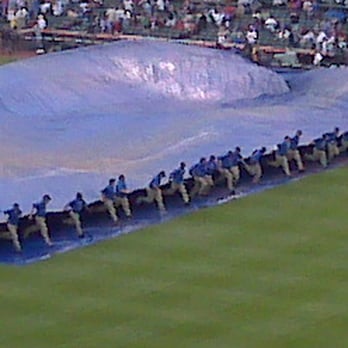 Wrigley Field - Die-hards waiting out the rain at Wrigley - Stadiums & Arenas Near Me - Chicago, Illinois