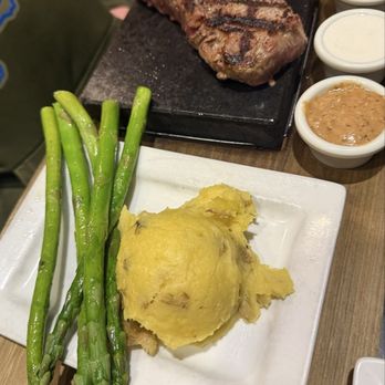 FireRock Grille - New York strip steak, garlic mashed potatoes, grilled asparagus - New American Near Me - Caledonia, Michigan FireRock Grille - New York strip steak, garlic mashed potatoes, grilled asparagus - New American Near Me - Caledonia, Michigan