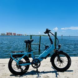Current Riders - Lectric XP 4 electric bike along the waterfront in Fort Myers Beach. Great for for exploring the island.