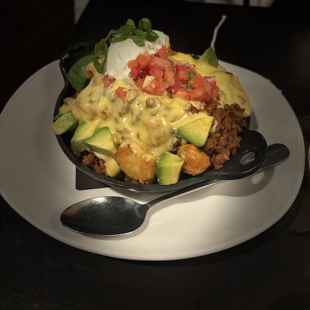 110 Grill - Chorizo totcho bowl. It's like loaded nachos but with tater tots instead of chips. It was amazing - New American Near Me - Poughkeepsie, New York 110 Grill - Chorizo totcho bowl. It's like loaded nachos but with tater tots instead of chips. It was amazing - New American Near Me - Poughkeepsie, New York