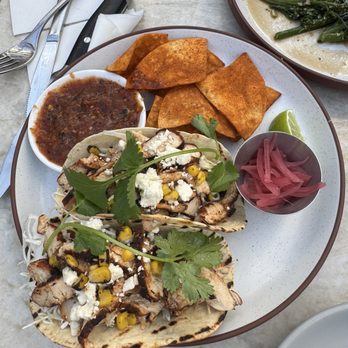 Earls Kitchen + Bar - Pollo Chicken Tacos- Grilled chicken, smashed avocado, charred corn, pickled onions, chipotle crema, cabbage, crumbled feta, cilantro - New American Near Me - Fort Lauderdale, Florida